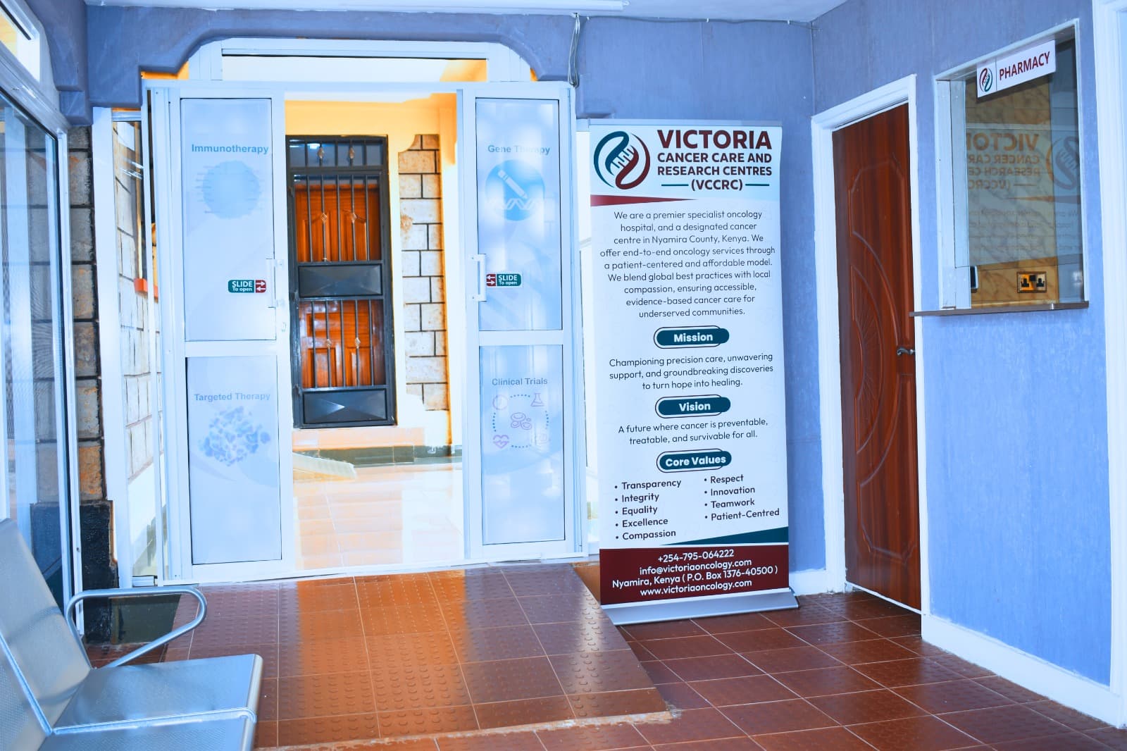 VCCRC caregivers with patient at the Nyamira center